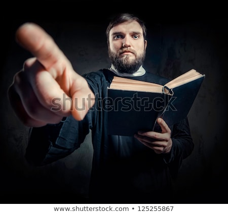 Stock foto: Portrait Of Priest Against Dark Background