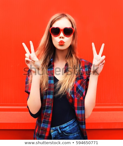 Stock fotó: Teenage Girl In Heart Shaped Sunglasses