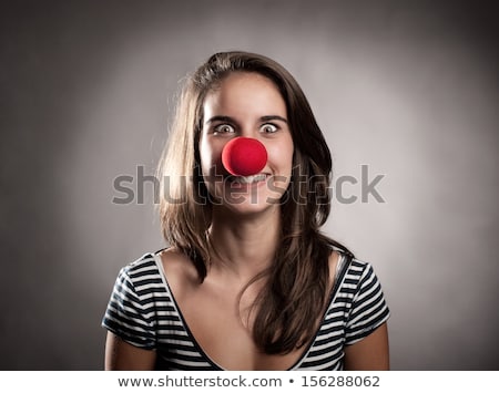 Zdjęcia stock: Smiling Teenage Girl With Red Clown Nose