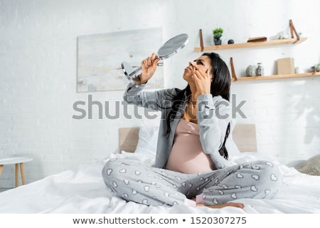 Stock fotó: Pregnant Woman Looking In The Mirror