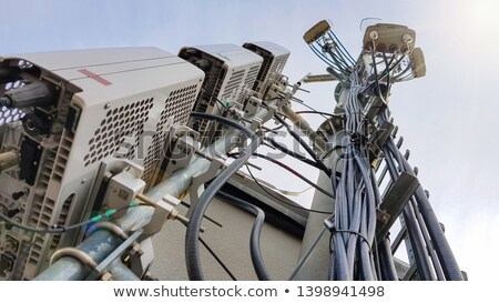 Stok fotoğraf: Industrial Building With Gsm Antennas On Roof