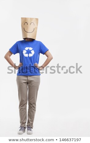 Сток-фото: Woman Wearing Paper Bag With Happy Facial Expression On Head
