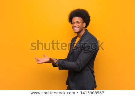 Foto stock: Businessman Holding Something