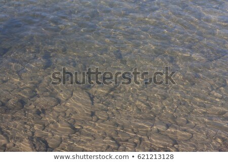 Zdjęcia stock: Transparent Shallow Water With Reef Rocky Bottom Fading Away To Deeper Area At Top Photo