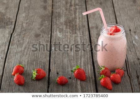 Сток-фото: Strawberry Smoothie Or Milkshake In Jar On Wood Rustic Backgroun