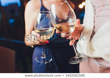 Stock fotó: Hands With Red Wine Toasting Over Served Table With Food