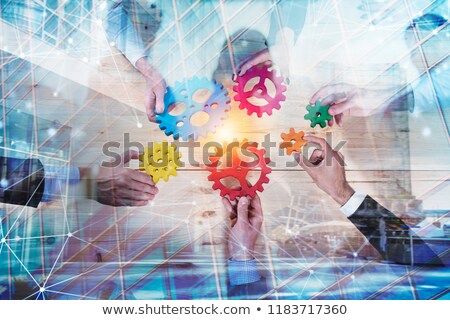 Foto stock: Business Team With Gears System Teamwork Partnership And Integration Concept With Network Effect