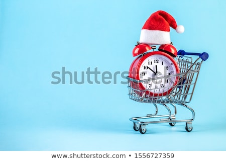 [[stock_photo]]: Christmas Snowman Toy And Alarm Clock