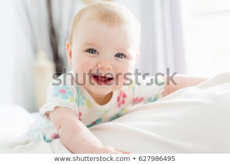 [[stock_photo]]: Beautiful Baby Girl In The Bed At Home