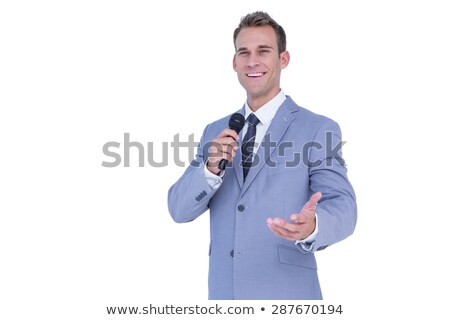 Stok fotoğraf: Happy Businessman Speaking With Micro