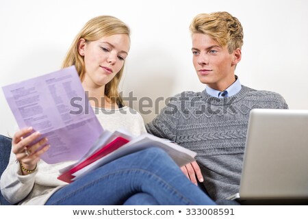 Imagine de stoc: Young Couple Balancing Their Checkbook