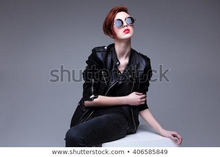 Stockfoto: Portrait Of A Young Woman In Leather Jacket