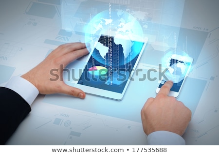 Stock fotó: Businessman With Tablet Pc And Earth Hologram