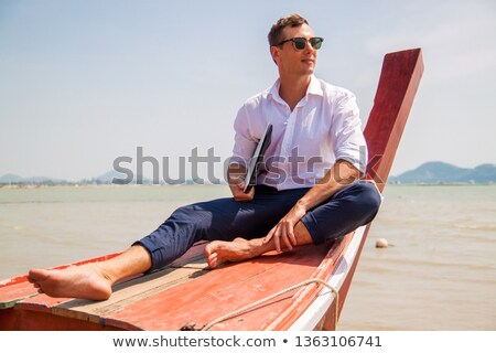 ストックフォト: Close Up Of Man Sitting In Boat