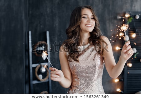 Stok fotoğraf: Cute Young Woman Celebrating With A Sparkler