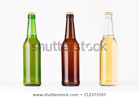 ストックフォト: Three Beer Bottles Longneck 500ml Different Colors With Blank White Label On White Wooden Board Moc