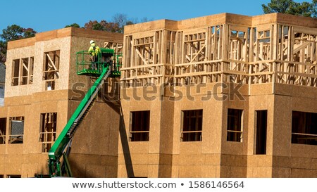 Stock photo: Construction Crane At The Construction Site On A Cloudless Sky