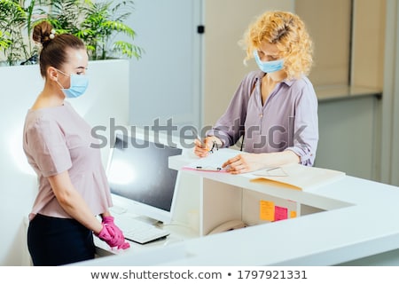 [[stock_photo]]: Female Receptionist