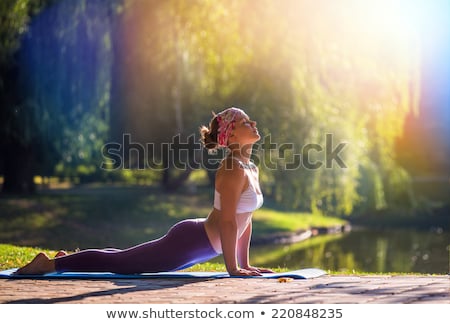 Сток-фото: Concentrated Young Sports Woman In Park Outdoors Meditate