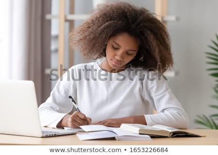 Stock fotó: Hands Of Young Diligent College Student With Pen Making Notes In Copybook