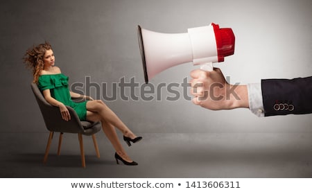 Zdjęcia stock: Elegant Model Sitting Opposite With A Big Loudspeaker