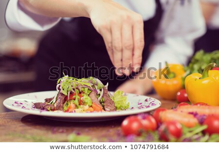 Chef Garnishing Prepared Meal [[stock_photo]] © dotshock