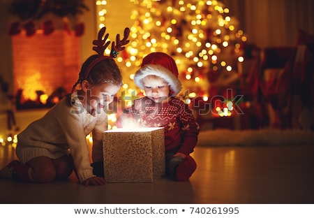 Stock fotó: Little Girl On The Background Of The Fireplace And New Year Tree