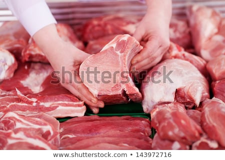 Foto stock: A Piece Of Meat In Female Hand