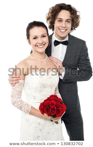 Couple In Suits Embracing Against A White Background Foto stock © stockyimages
