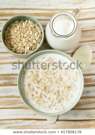 Stock fotó: Bowl Of Milk With Granola And Berries Fruit