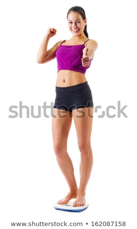 Zdjęcia stock: Slim Woman Cheering On Scales