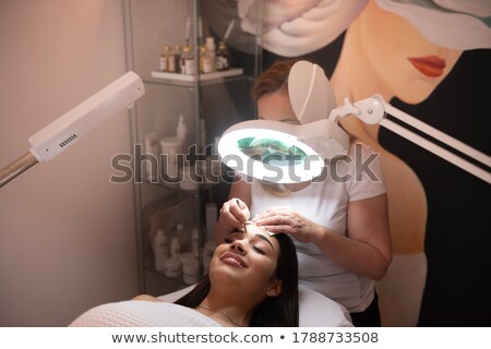 Zdjęcia stock: Woman Getting Her Eyelashes Done In The Beauty Salon