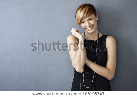 Foto d'archivio: Portrait Of Beautiful Young Woman In A Black Dress