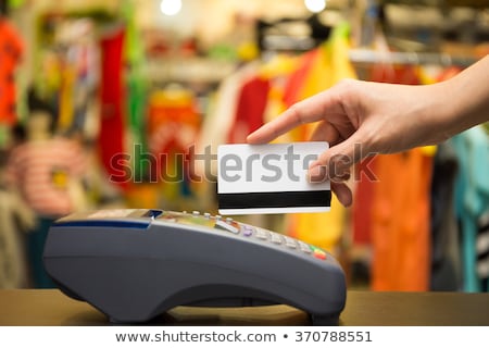 Stock fotó: Hand Swiping Credit Card In Store