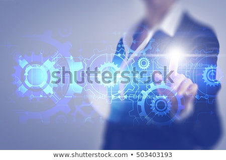Foto stock: Business Woman Working On Tablet With Gears Concept