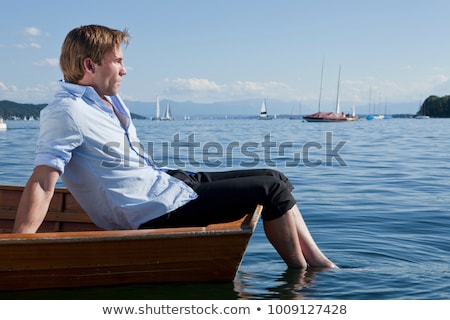 Stockfoto: Three Businessmen Relaxing In Rowboat