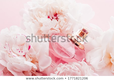 Foto stock: Luxe Fragrance Bottle As Girly Perfume Product On Background Of Peony Flowers Parfum Ad And Beauty