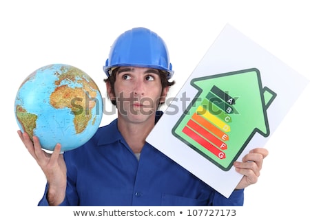 Сток-фото: Craftsman Holding An Energy Consumption Label