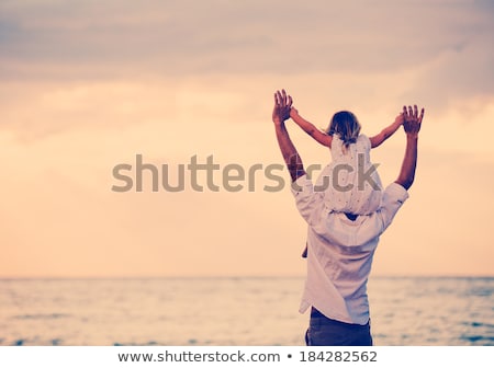 Stock photo: Dad And Little Daughter On The Beach