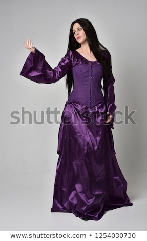 Foto stock: Back View Of Beautiful Woman In Purple Corset