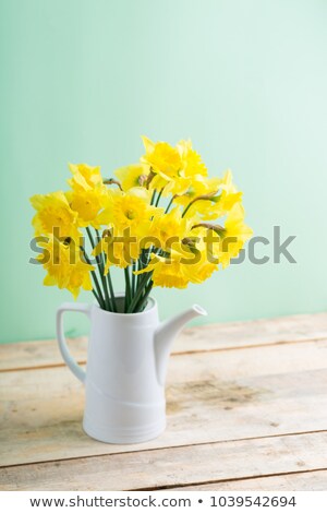 Сток-фото: Easter Eggs On The Table In A Ceramic Vase