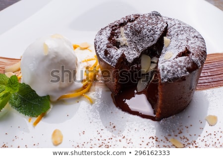 Stok fotoğraf: Warm Cut Chocolate Fondant With Ice Cream And Cinnamon Tasty Fr