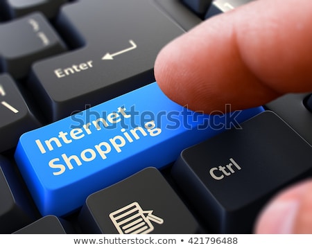 Foto stock: Finger Presses Blue Keyboard Button Internet Trading