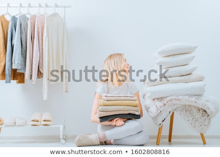 Stock foto: Woman With Bath Towels And Drying Rack At Home