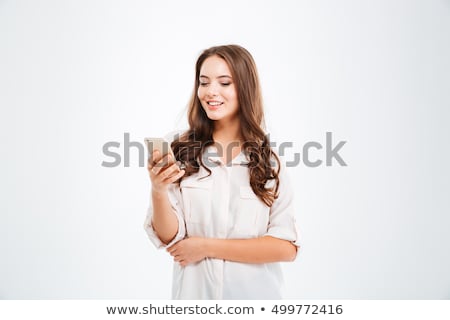 Stock photo: Portrait Of A Happy Young Woman Using Mobile Phone