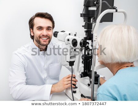 Stock fotó: Smiling Ethnic Woman Working As Oculist