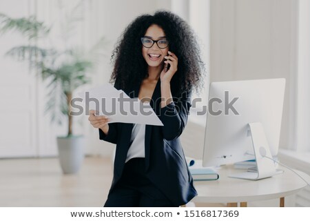 Zdjęcia stock: Intelligent Woman With Afro Hairstyle Holds Paper Documents Checks Information Calls Business Par