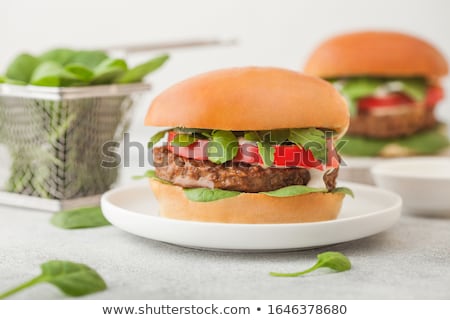 Stockfoto: Healthy Vegetarian Meat Free Burgers On Round Ceramic Plate With Vegetables On Light Table Backgroun