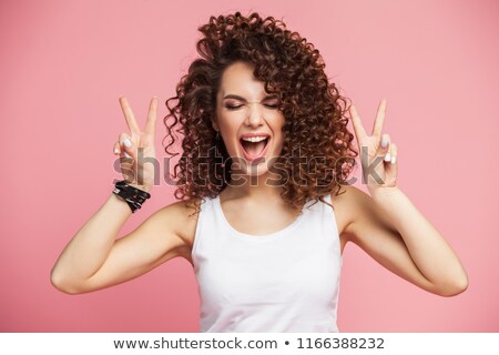 Foto d'archivio: Woman With Curly Hair Posing