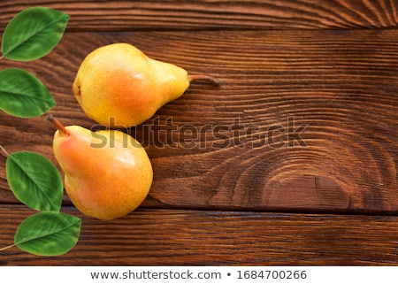 Stockfoto: Yellow Pear On Wooden Table